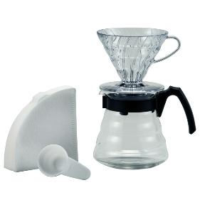 Set de preparación de café con gotero, jarra de vidrio, filtros y cuchara dosificadora, ideal para tienda de café de especialidad.